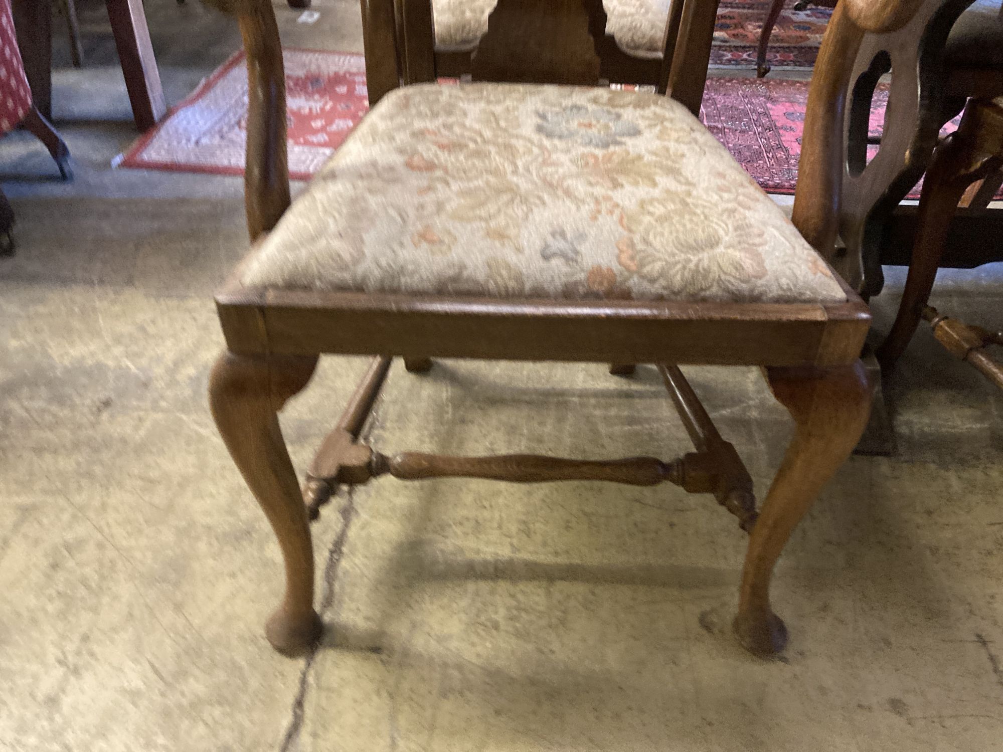 A set of eight 1920s oak Queen Anne-style dining chairs, two with arms